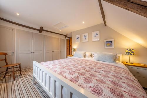 a bedroom with a large bed in a room at Gable End in Great Snoring