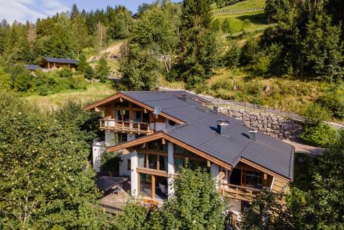 an aerial view of a house with a metal roof at Chalet VIE in Viehhofen
