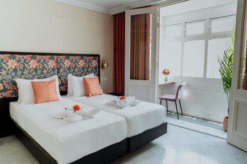 Postel nebo postele na pokoji v ubytování King Charles Hotel