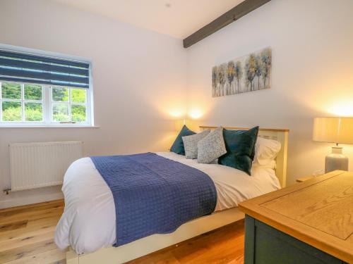 Voodi või voodid majutusasutuse Calvin's Cottage toas