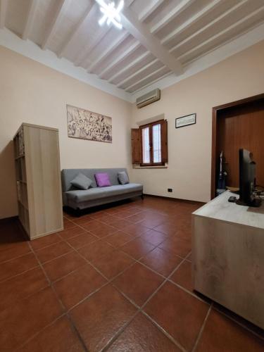 Postel nebo postele na pokoji v ubytování L'antica dimora Torre di Cascina