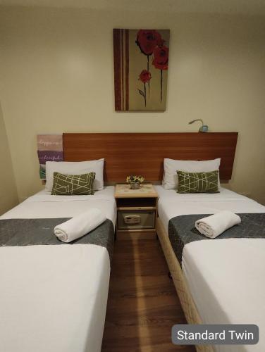 Кровать или кровати в номере SCC Hotel City Centre