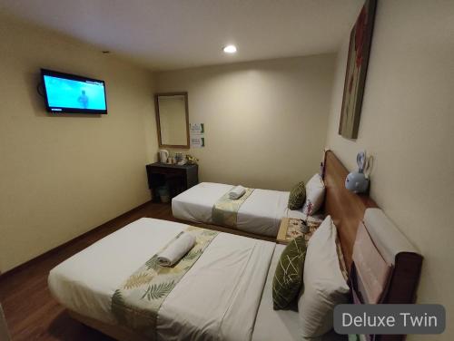 Кровать или кровати в номере SCC Hotel City Centre