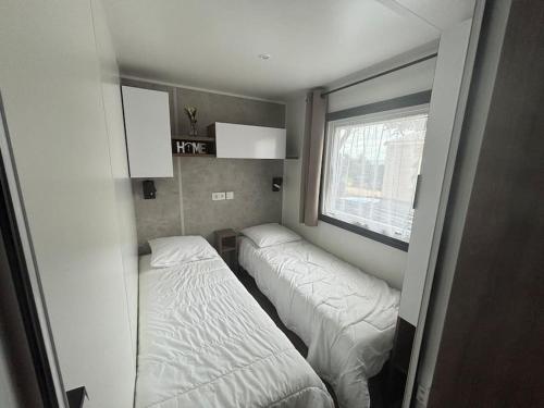 Postel nebo postele na pokoji v ubytování Mobil home Cygne 85