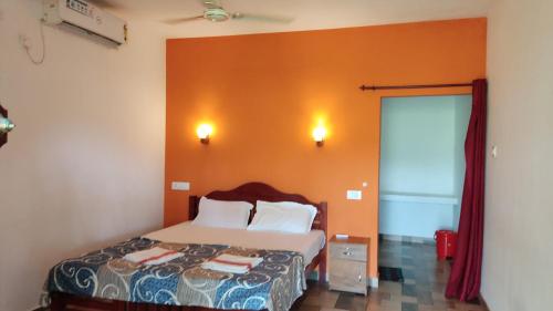 Postel nebo postele na pokoji v ubytování paddy farm beach resort odayam varkala