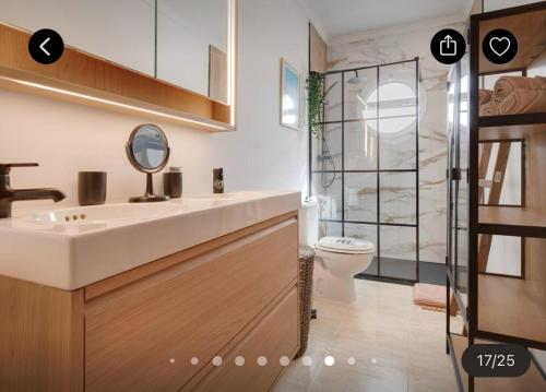 a bathroom with a sink and a toilet and a shower at Las Arenas Family in Costa Calma