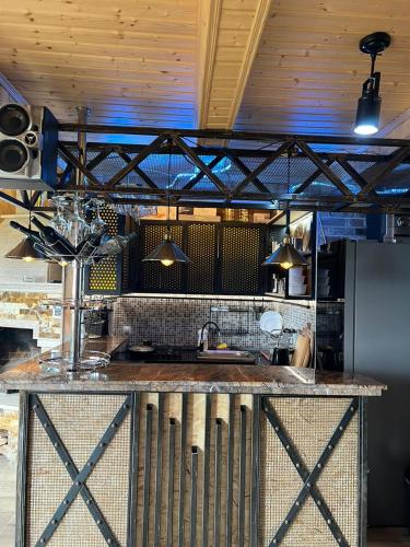 a kitchen with a counter with a sink at Panorama Gomismta in Gomi
