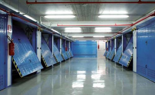 a long hallway with blue seats in a building at La Finestra d'Arezzo in Arezzo