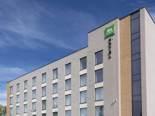 a building with a sign on the side of it at ibis Styles Burton On Trent in Burton upon Trent