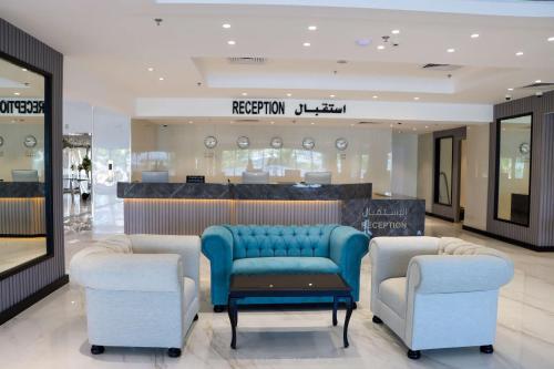a store with two chairs and a blue couch in a lobby at Best Western Plus Jeddah Hotel Madinah Road in Jeddah