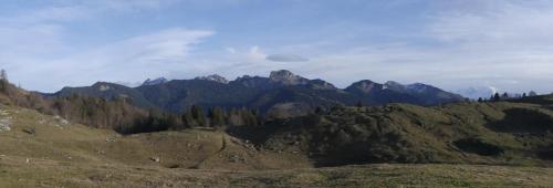 a view of a mountain range with trees and mountains at Chambre avec lit 2 personnes in Ville-en-Sallaz
