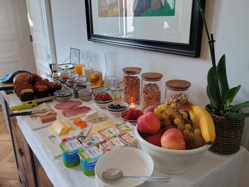 a table with a bunch of food on it at Villa Paignon in Montbron