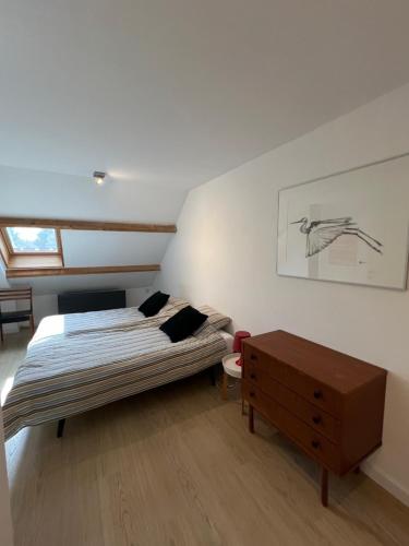 Ένα ή περισσότερα κρεβάτια σε δωμάτιο στο Surferhuis