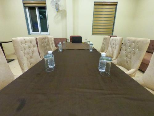 a table with bottles of water on top of it at The Taj Vista Agra -walking distance to Taj Mahal in Agra
