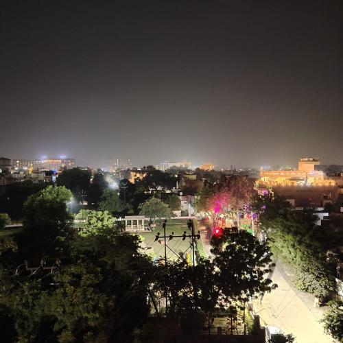 a view of a city at night with lights at The Taj Vista Agra -walking distance to Taj Mahal in Agra