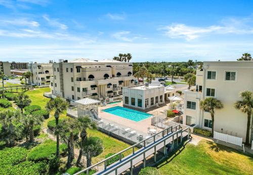 an aerial view of a apartment complex with a swimming pool at Royal Mansions, Ocean View Penthouse Condo in Cape Canaveral
