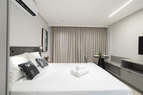 Postel nebo postele na pokoji v ubytování Way Tambaú - Studios Deluxe em João Pessoa por Carpediem