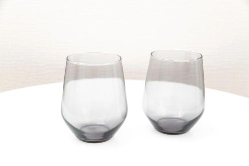 two glasses of milk sitting next to each other at FIKA Shibuya Honmachi 202 in Tokyo