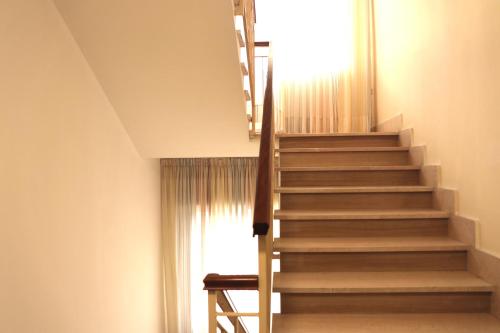 a staircase in a room with a window at Hotel Costa Verde in Tortoreto Lido