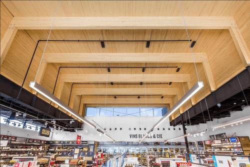 a view of a store with a large wooden ceiling at Renovated 2-Bedroom Haven by Jean Talon Market in Montréal