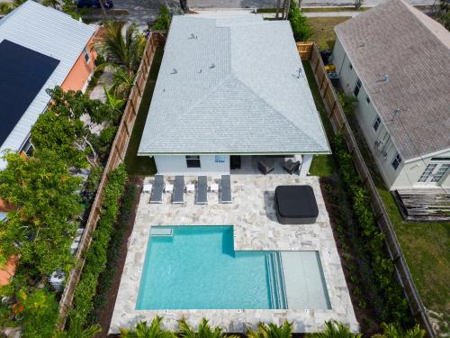 an aerial view of a house with a swimming pool at Palm Luxe Residence in West Palm Beach