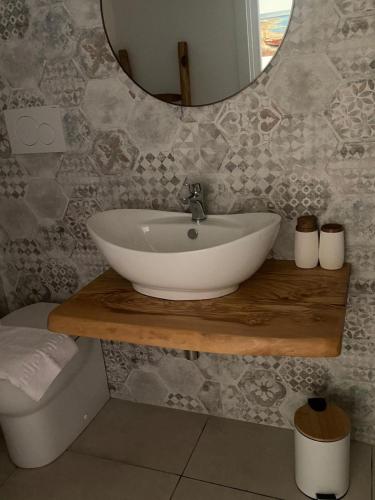 a bathroom with a sink and a mirror at Casa n'to strittu in Lipari
