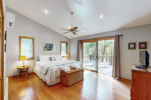 a bedroom with a bed and a sliding glass door at Mirabella Eclano in McHenry