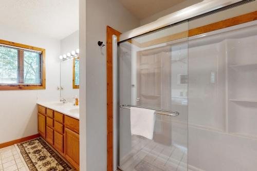 a bathroom with a shower with a glass door at Mirabella Eclano in McHenry