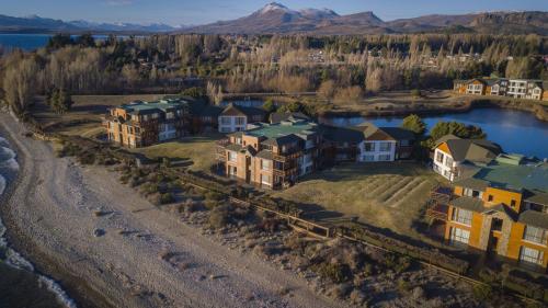 an aerial view of a house with a lake at Blue Aparts Dina Huapi Bariloche in Dina Huapi