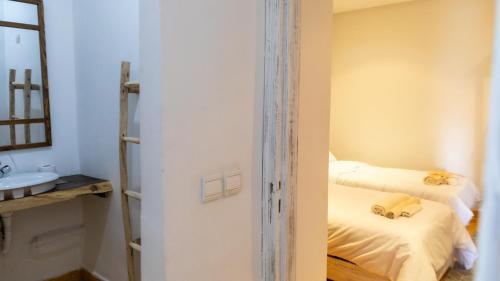 a bathroom with two beds and a sink at Dakhla Experience - Surf House in Dakhla