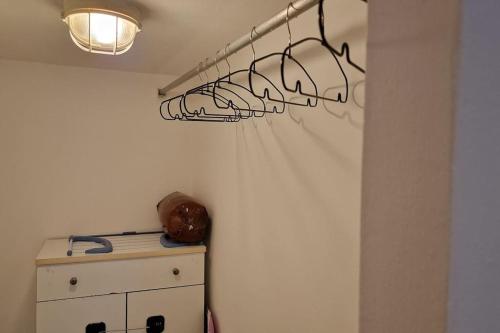 a room with a wall with a light and a cabinet at Puffy House in Genova