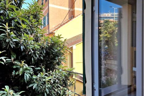 an open window with a view of a building at Puffy House in Genova