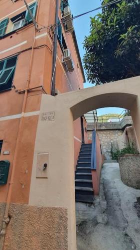 a stairway leading up to a building with a staircase at Puffy House in Genova