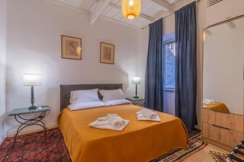 Postel nebo postele na pokoji v ubytování Pettinara Suites