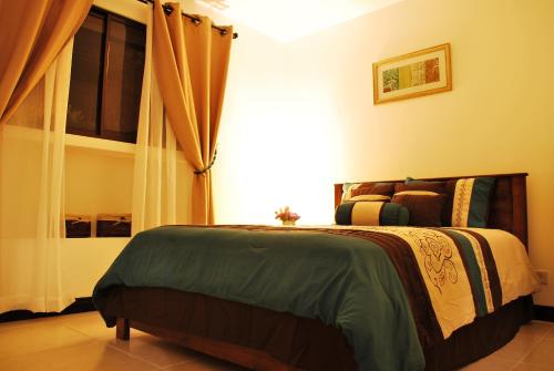 Un pat sau paturi într-o cameră la Apartotel Don Luis