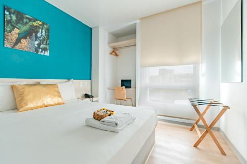 Postel nebo postele na pokoji v ubytování Hotel Quinto Nivel