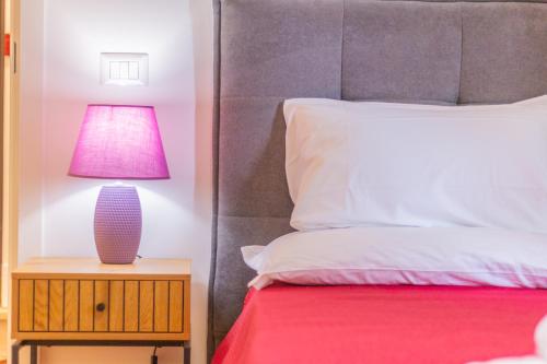 Postel nebo postele na pokoji v ubytování Pettinara Suites
