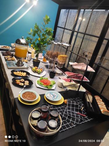 a table with plates of food on it at Hotel Europa in Montevideo