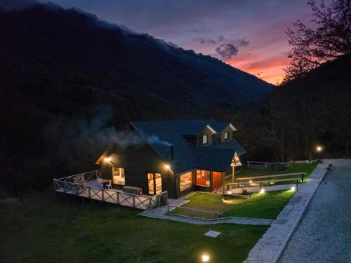 a house at night with the lights on at Loberias Del Sur in Puerto Chacabuco