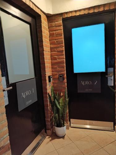 Μια τηλεόραση ή/και κέντρο ψυχαγωγίας στο Apartamentos Mara - 100m de Termas