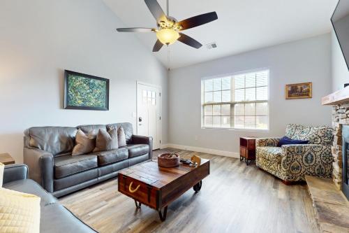 a living room with a couch and a table at Townsend Timbers in Townsend