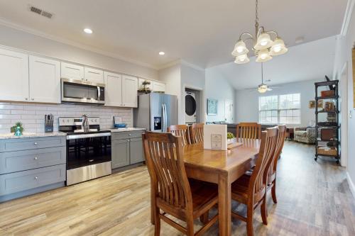 a kitchen and dining room with a wooden table and chairs at Townsend Timbers in Townsend