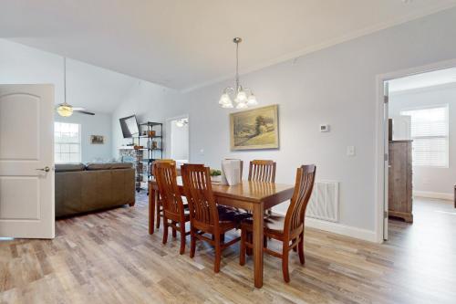 a dining room and living room with a table and chairs at Townsend Timbers in Townsend
