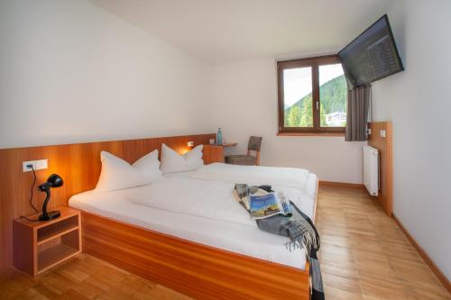 Postel nebo postele na pokoji v ubytování Bed & Breakfast Hostel Nives