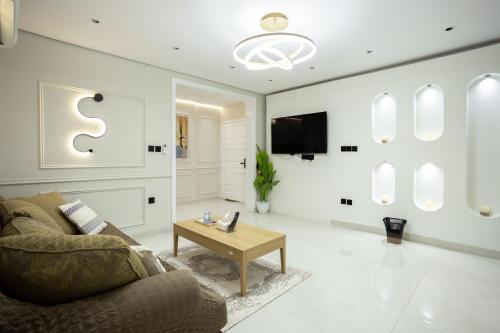 TV a/nebo společenská místnost v ubytování Dar Al-Naseem Apartments