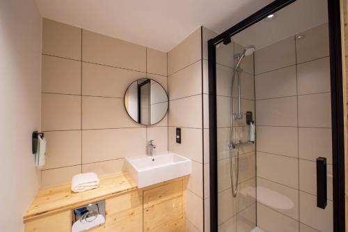 a bathroom with a sink and a shower at easyHotel Marseille Euromed in Marseille