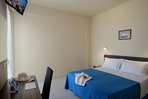 Postel nebo postele na pokoji v ubytování Hotel Excelsior