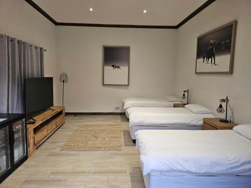 Letto o letti in una camera di Ugab Game Farm & Lodge
