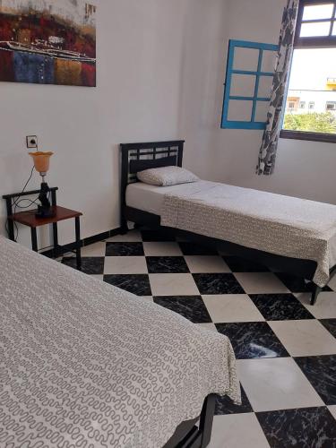 Ένα ή περισσότερα κρεβάτια σε δωμάτιο στο HOTELL Elizia