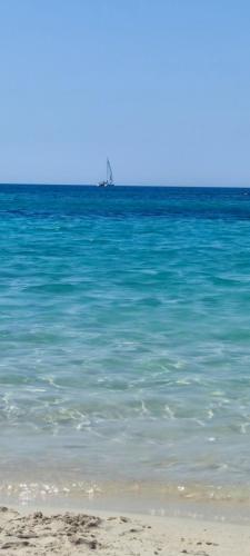 a view of the ocean with a boat in the distance at Quiet Home in Pula